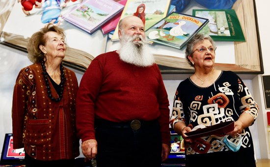 Kings County Supervisor Joe Neves honors members of the Friends of the Library, including its president, Carol Dias.